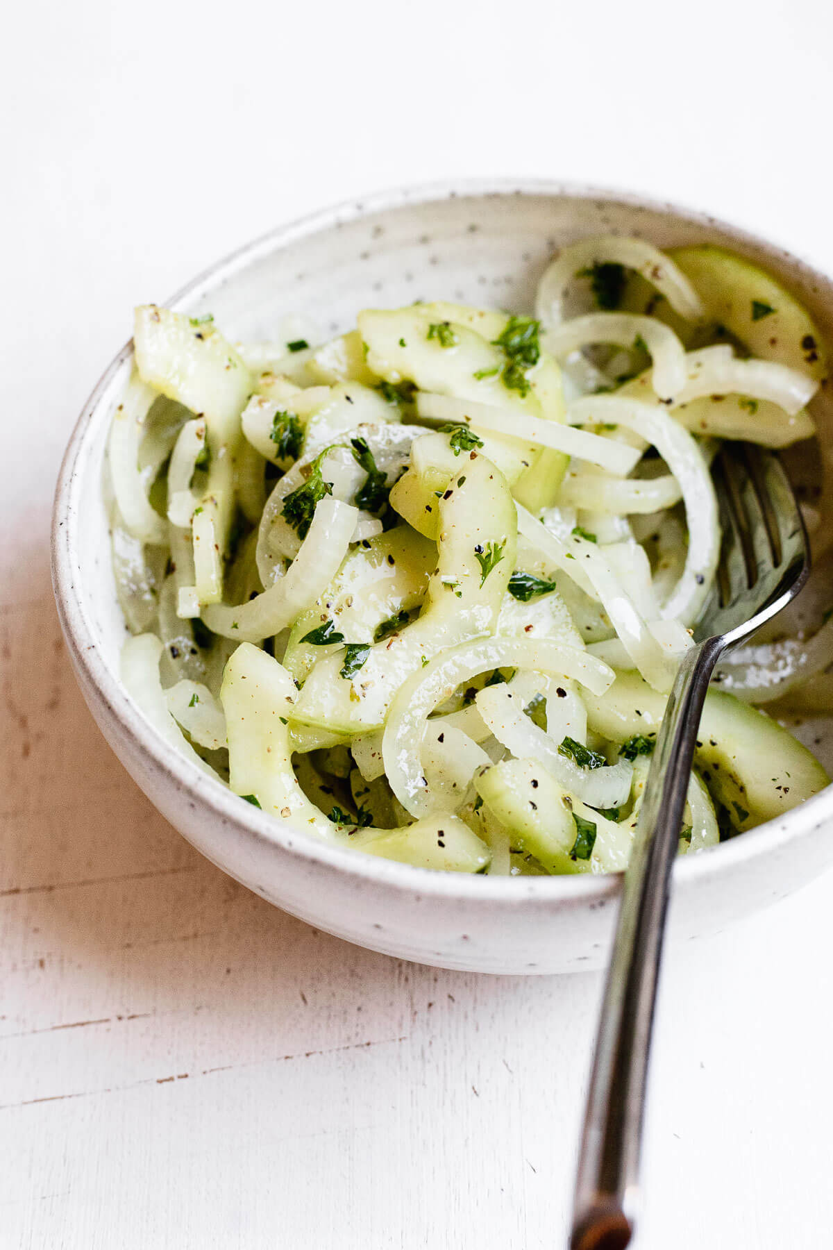 Onion and Cucumber Salad on white background