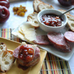 Plates of cheese and bread with Asian Plum Onion Chutney